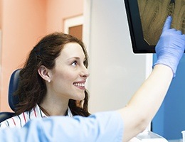 Woman looking at x-rays on computer