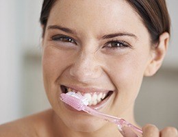 Woman brushing teeth