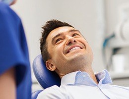 Smiling man in dental chair