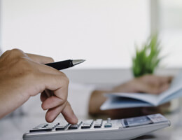 man using a calculator