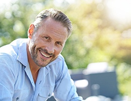 a man smiling with dentures in Ann Arbor