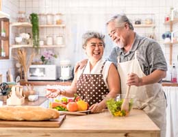 Couple smiling with dentures in Ann Arbor