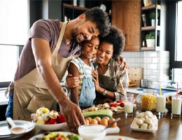 a family cooking together in their kitchen