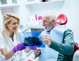 Man enjoying his new dental implants in Ann Arbor after placement