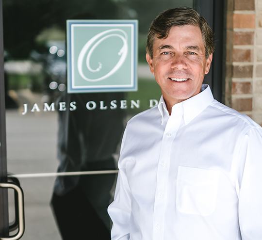 Ann Arbor dentist James Olsen D D S standing outside of dental office