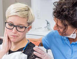 woman with jaw pain at phase one T M J treatment