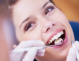 Woman receiving dental exam