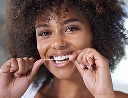 Woman flossing