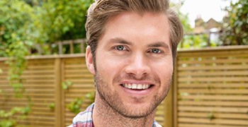 Smiling young man outdoors