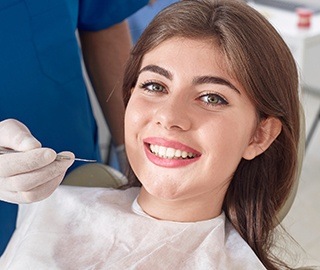 Smilig woman in dental chair