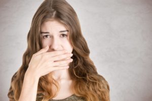 A woman with bad breath.