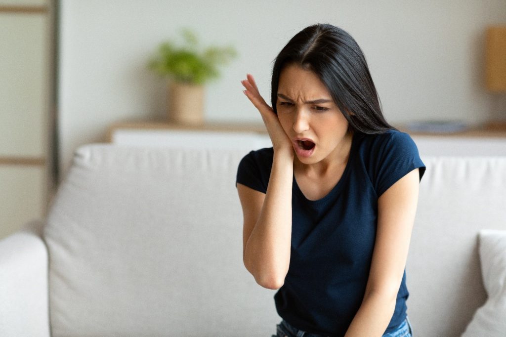 Woman with TMJ pain.